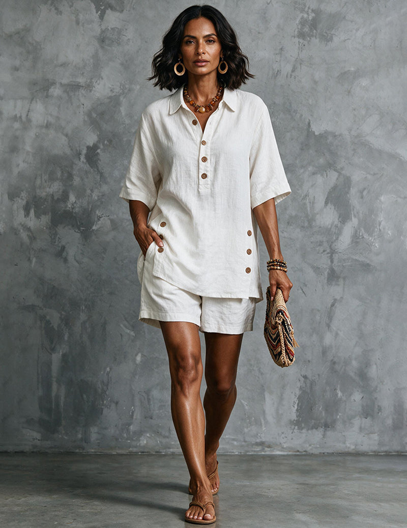 White linen collared short-sleeve button shirt with matching shorts, walking stance