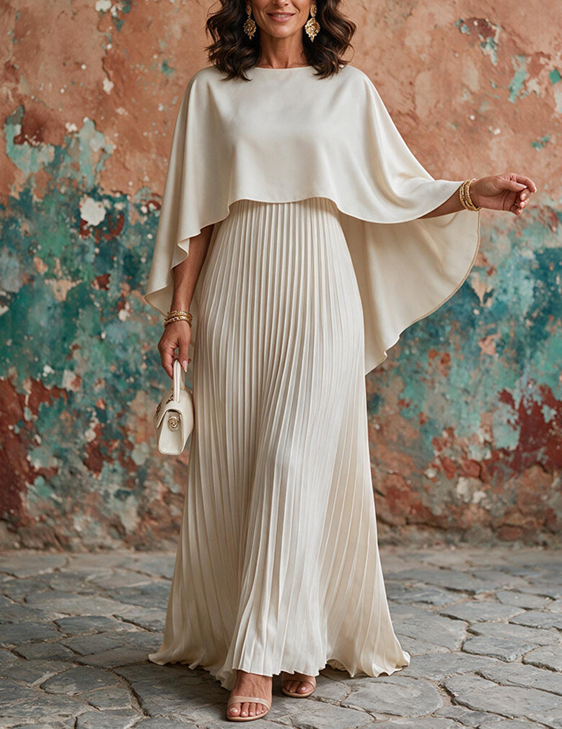 Beige pleated maxi dress with draped batwing cape overlay and asymmetrical hemline