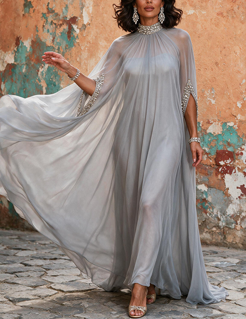 Grey beaded high-neck gown with pleated skirt and long flowing cape