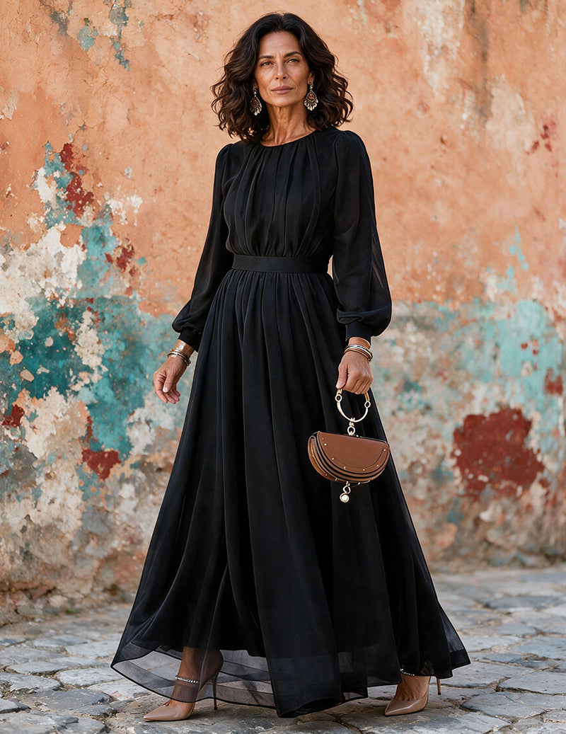 Black long-sleeve chiffon maxi dress with pleated skirt and elastic-waist bodice.