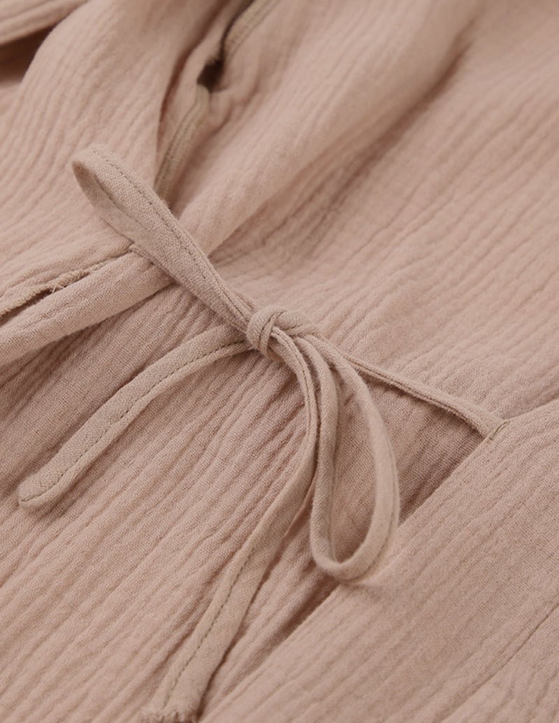 Khaki robe tie belt knotted at wrap waist on textured crinkle fabric