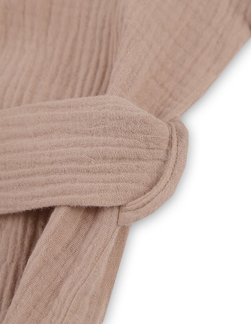 Khaki sleeve cuff and wrap seam on textured crinkle fabric
