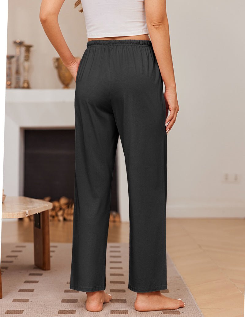 Solid black pajama pants with elastic waist and drawstring, roomy wide-leg