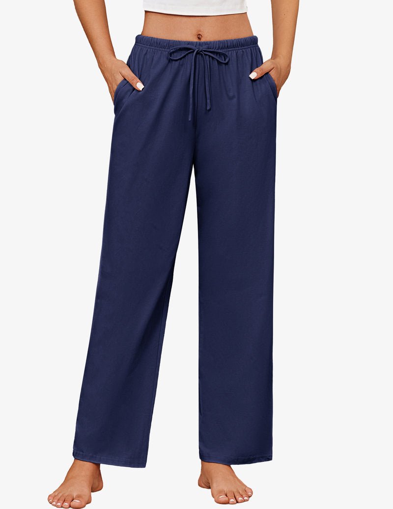 Navy blue cotton pajama pants with elastic waist and drawstring ties, wide relaxed fit