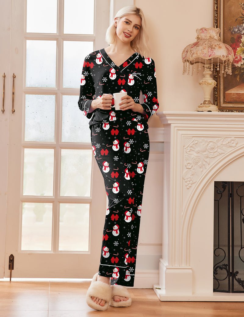 Black V-neck pajama set with red heart and snowman prints, long pants