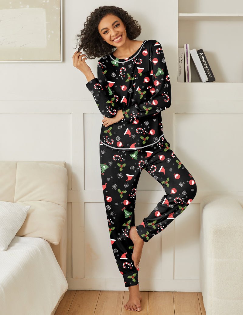 Black holiday pajama set with long sleeves and allover multicolor print, drawstring waist