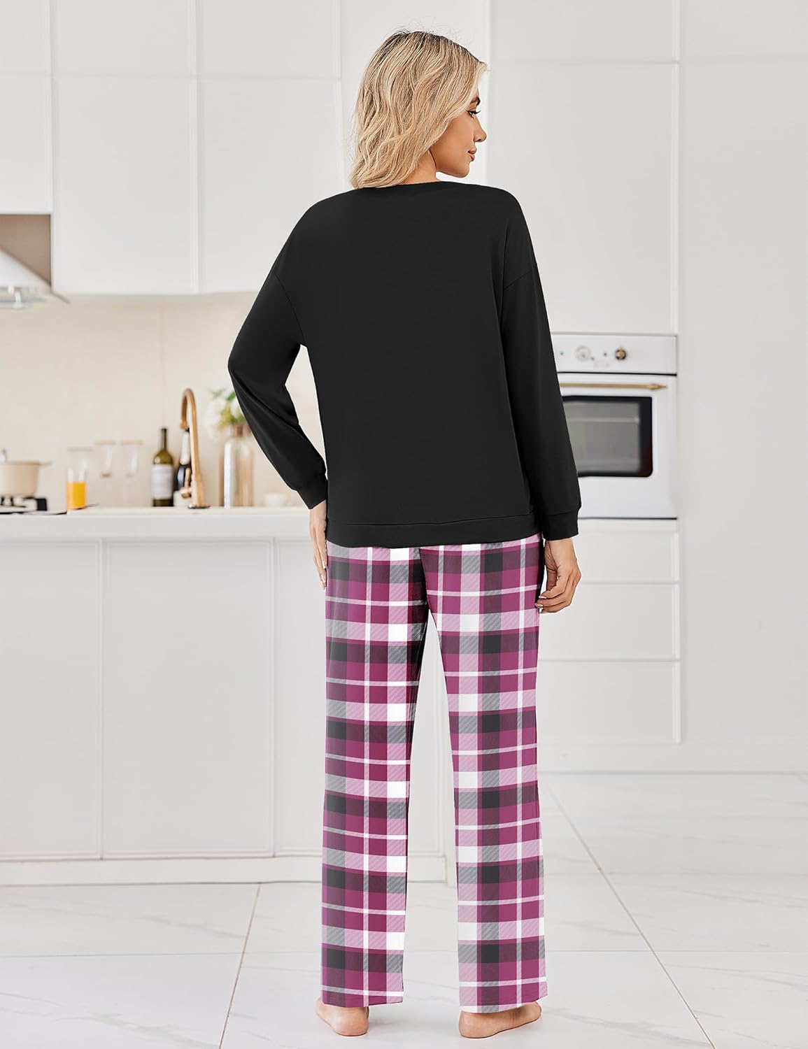 Black long-sleeve pajama top with back view seam detail, paired with plaid pants