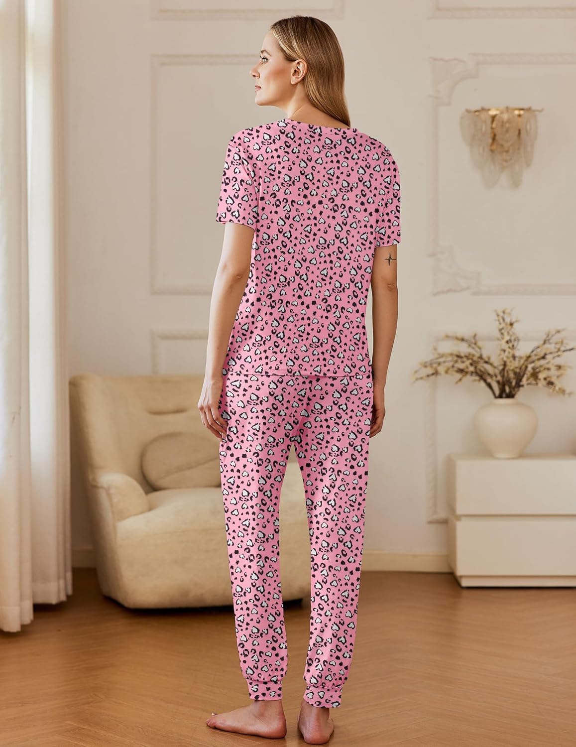 Pink leopard print pajama set—short-sleeve top and matching long pants with drawstring