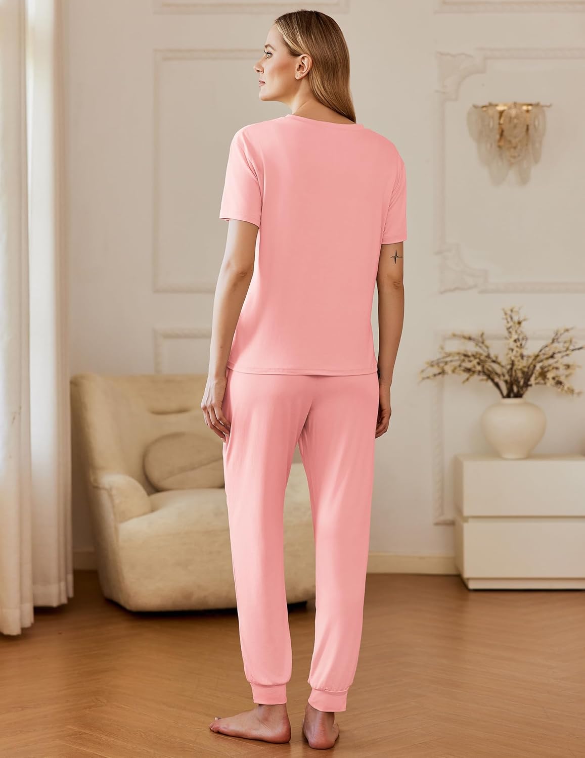 Back view: pink short-sleeve pajama set with tapered pants and drawstring cuffs
