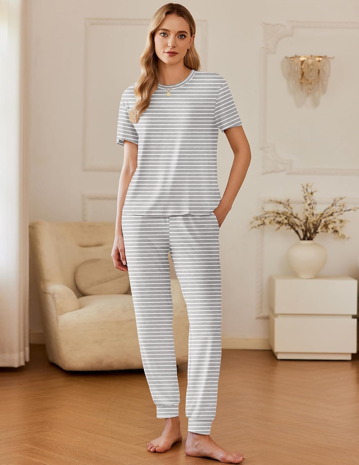 Short sleeve pajama set in light gray with white horizontal stripes; matching long pants with slit