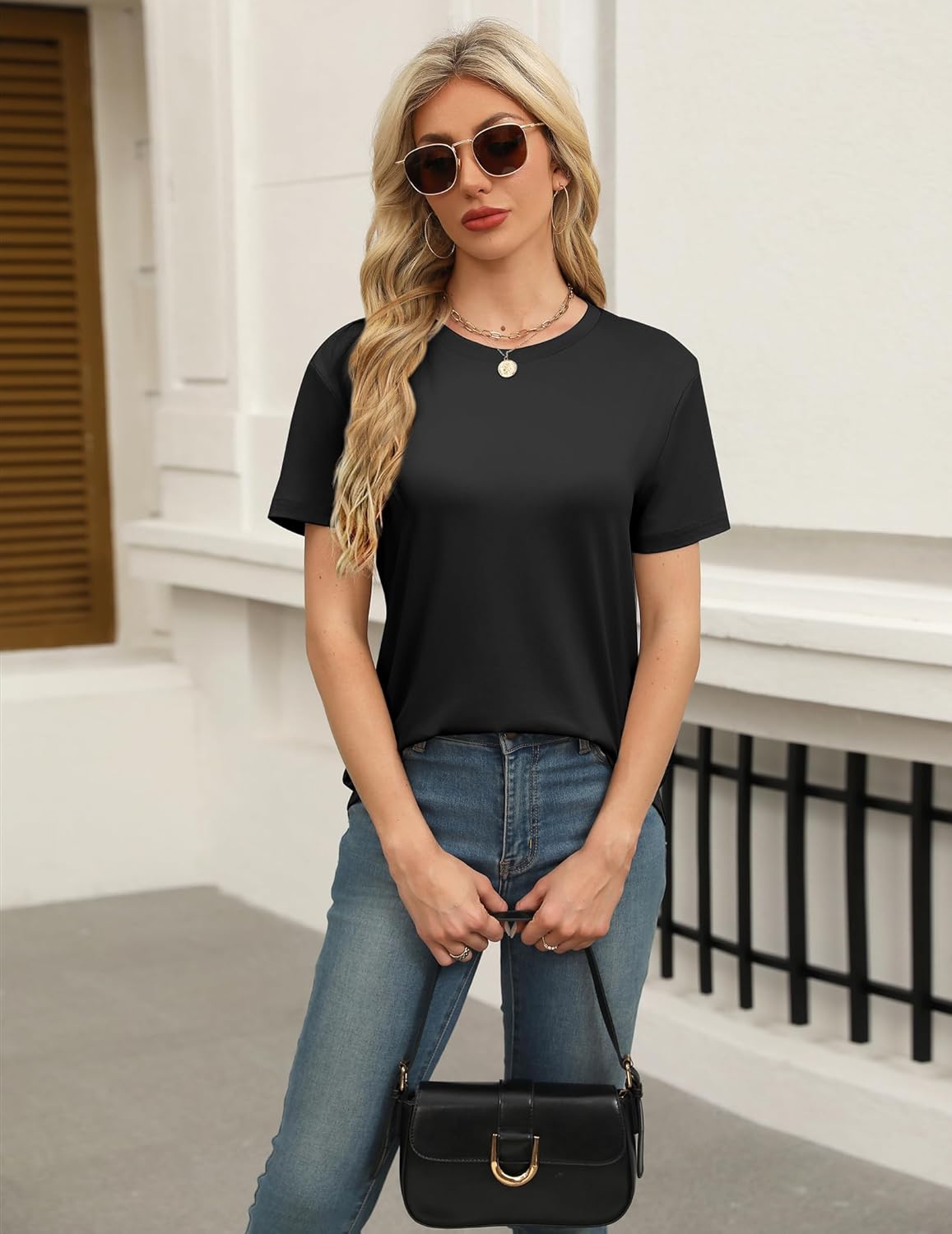 Black short-sleeve lounge top with round neckline and small button at center