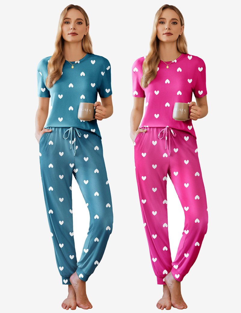 2-pack short sleeve pajama sets: teal top and pants with small white heart print; pink hearts set