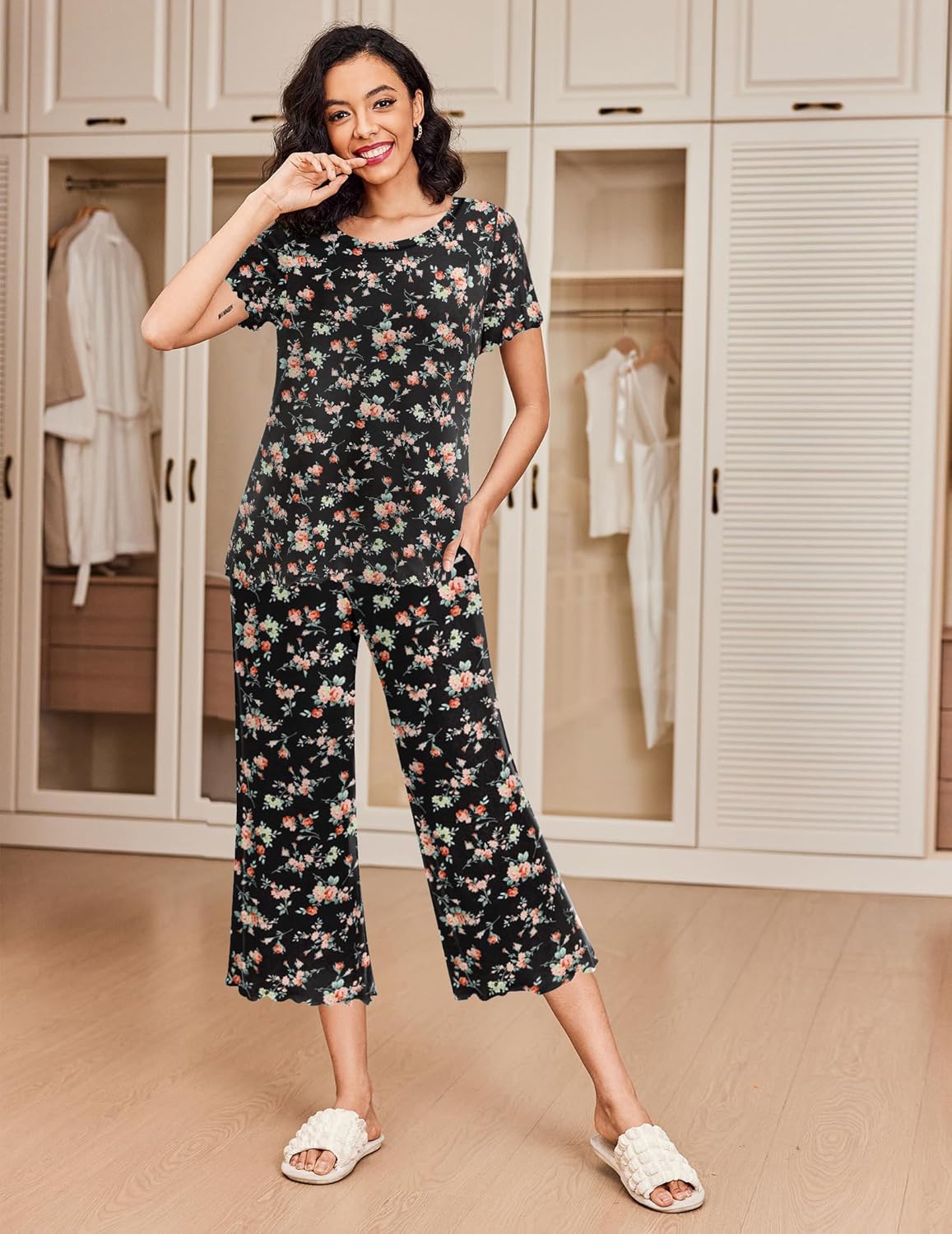 Women’s pajama set in black floral print short-sleeve top and cropped matching pants