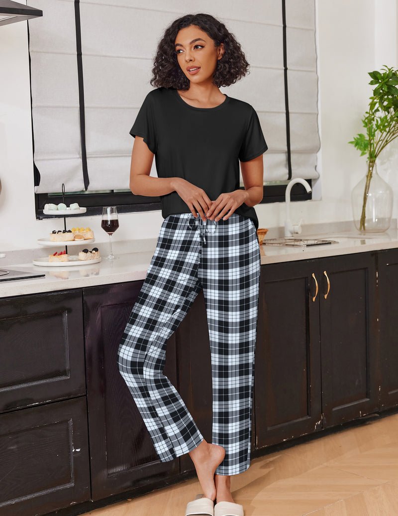 Black short-sleeve pajama top with black-and-white plaid long lounge pants