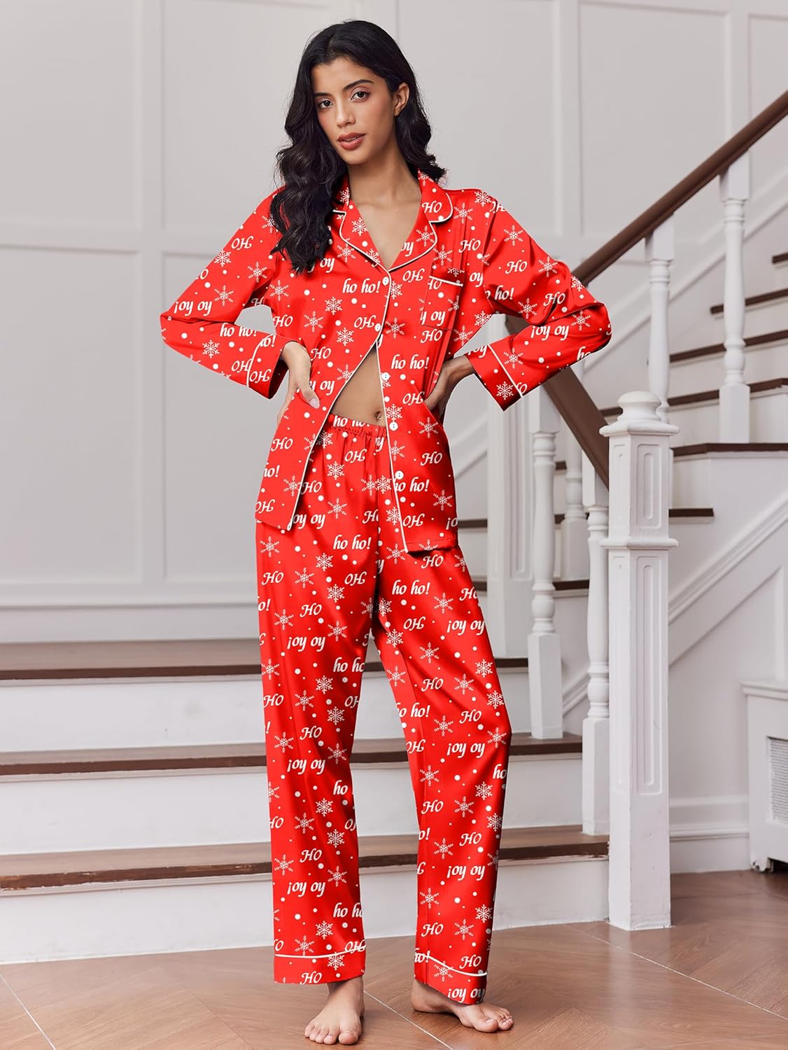 Red satin pajama set with button-up top and long pants, festive print