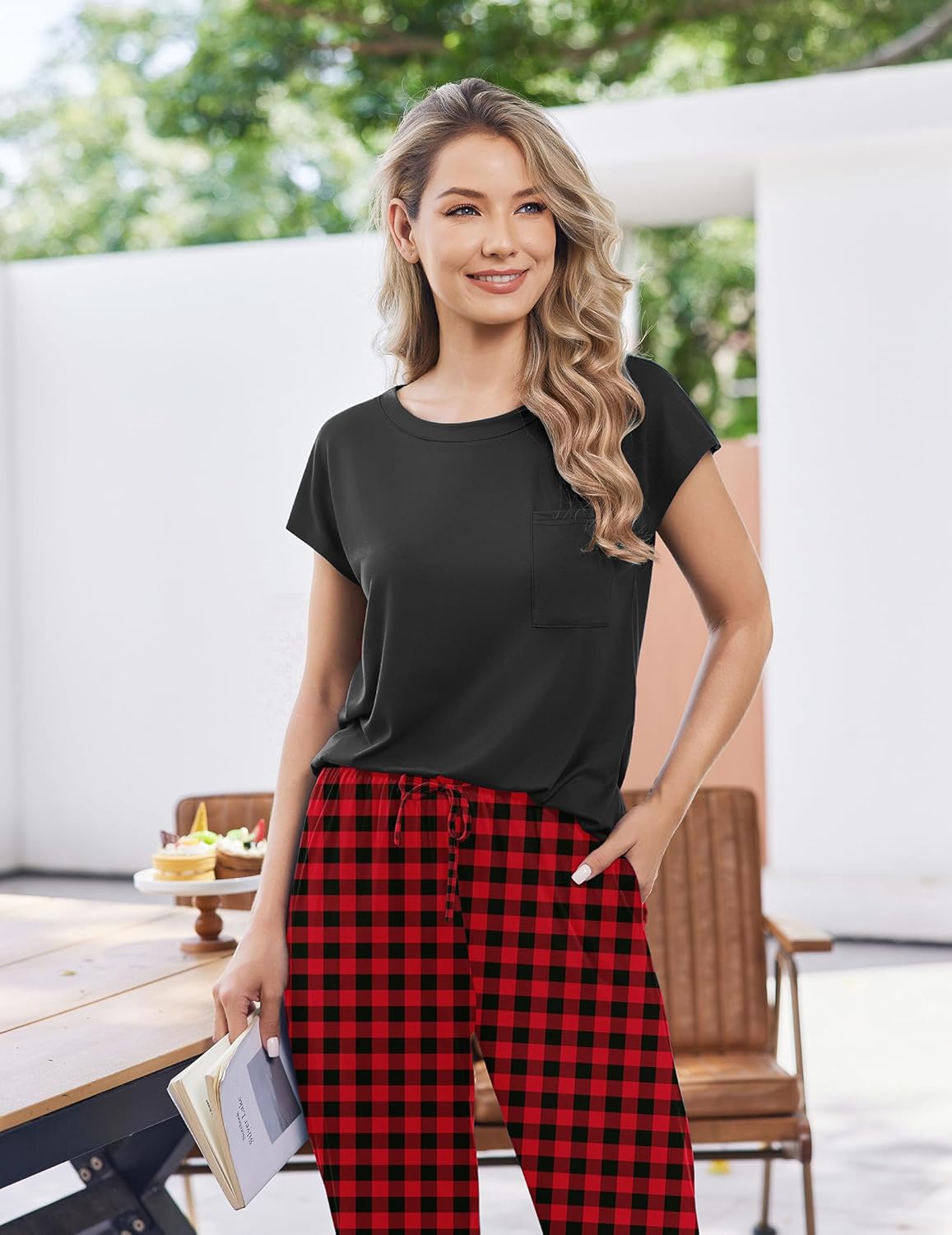 Black cap-sleeve top with red plaid jogger pants and drawstring waist