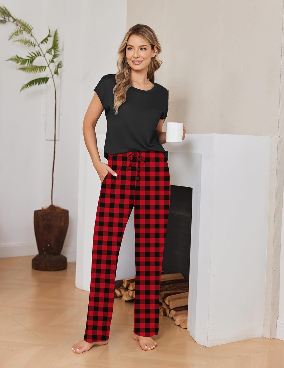 Black cap-sleeve top with red plaid drawstring jogger pants