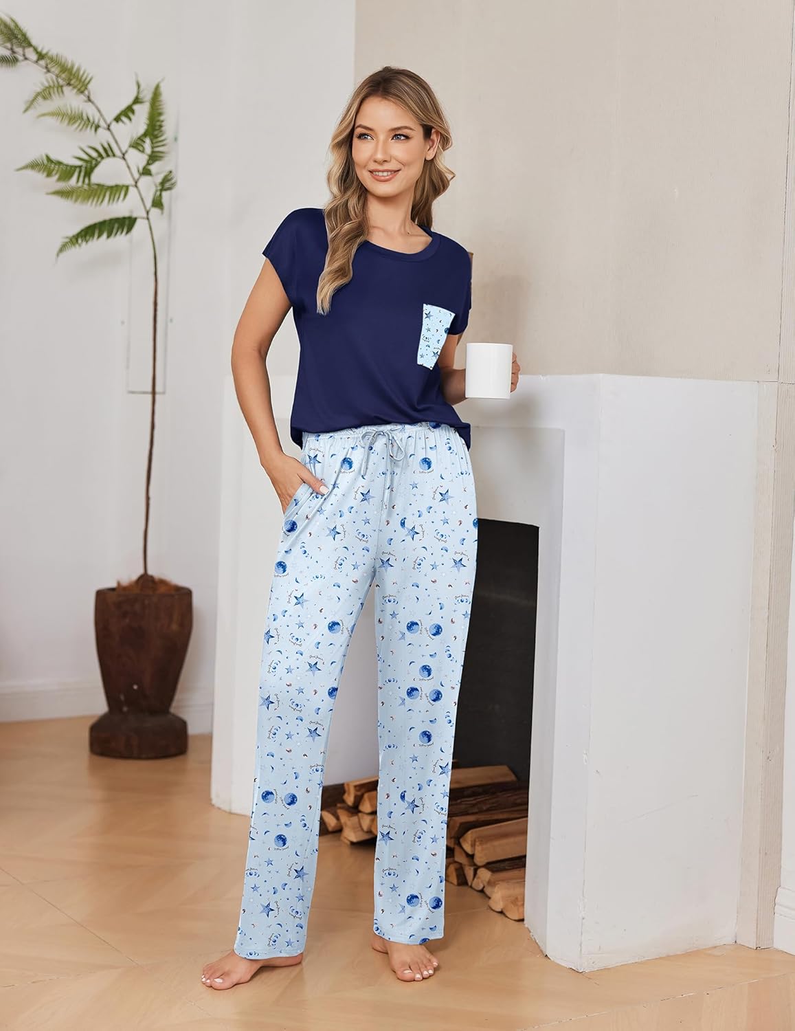 Cap-sleeve pajama set with navy top and light blue patterned pants, drawstring waist
