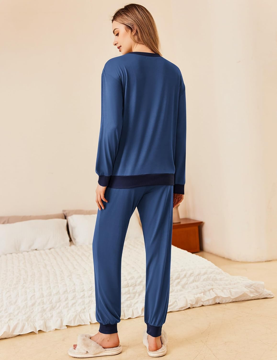 Back view: deep blue pajama top with tapered matching jogger pants