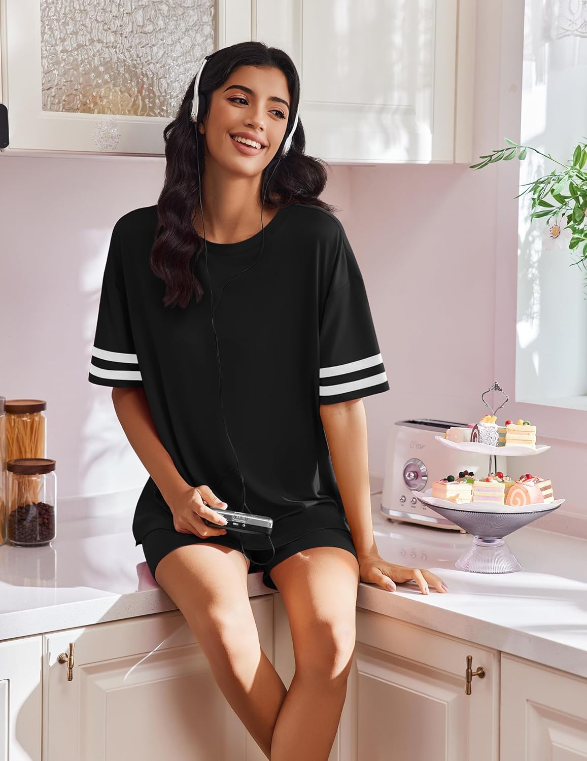 Black 2-piece lounge set with striped sleeve cuffs and relaxed shorts
