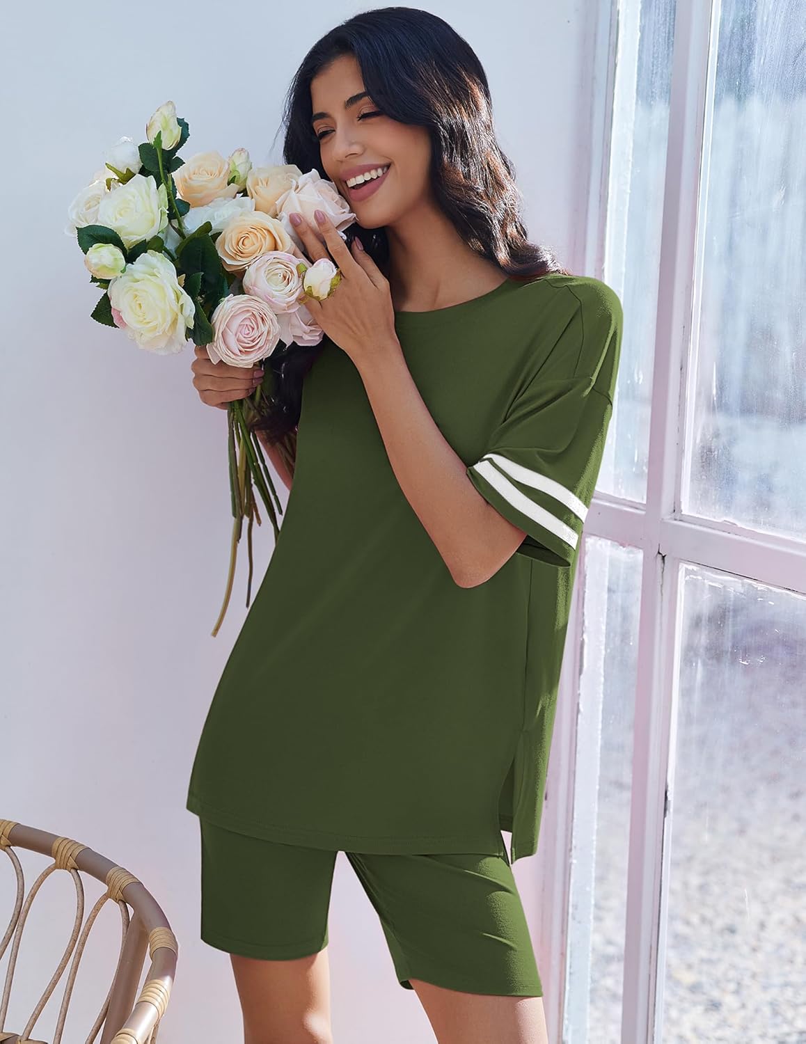 Two-piece lounge set with oversized green top and matching shorts, striped sleeve cuffs.