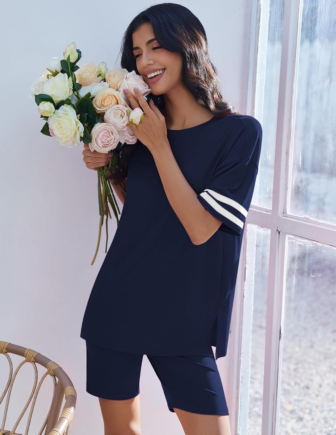 Two-piece lounge set in navy blue with oversized top and matching shorts, striped sleeve cuffs.