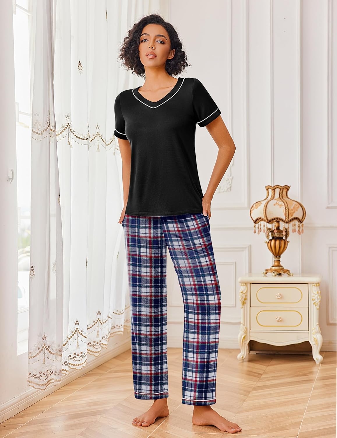 Black lounge set with red plaid pants: short-sleeve top with contrast V-neck trim