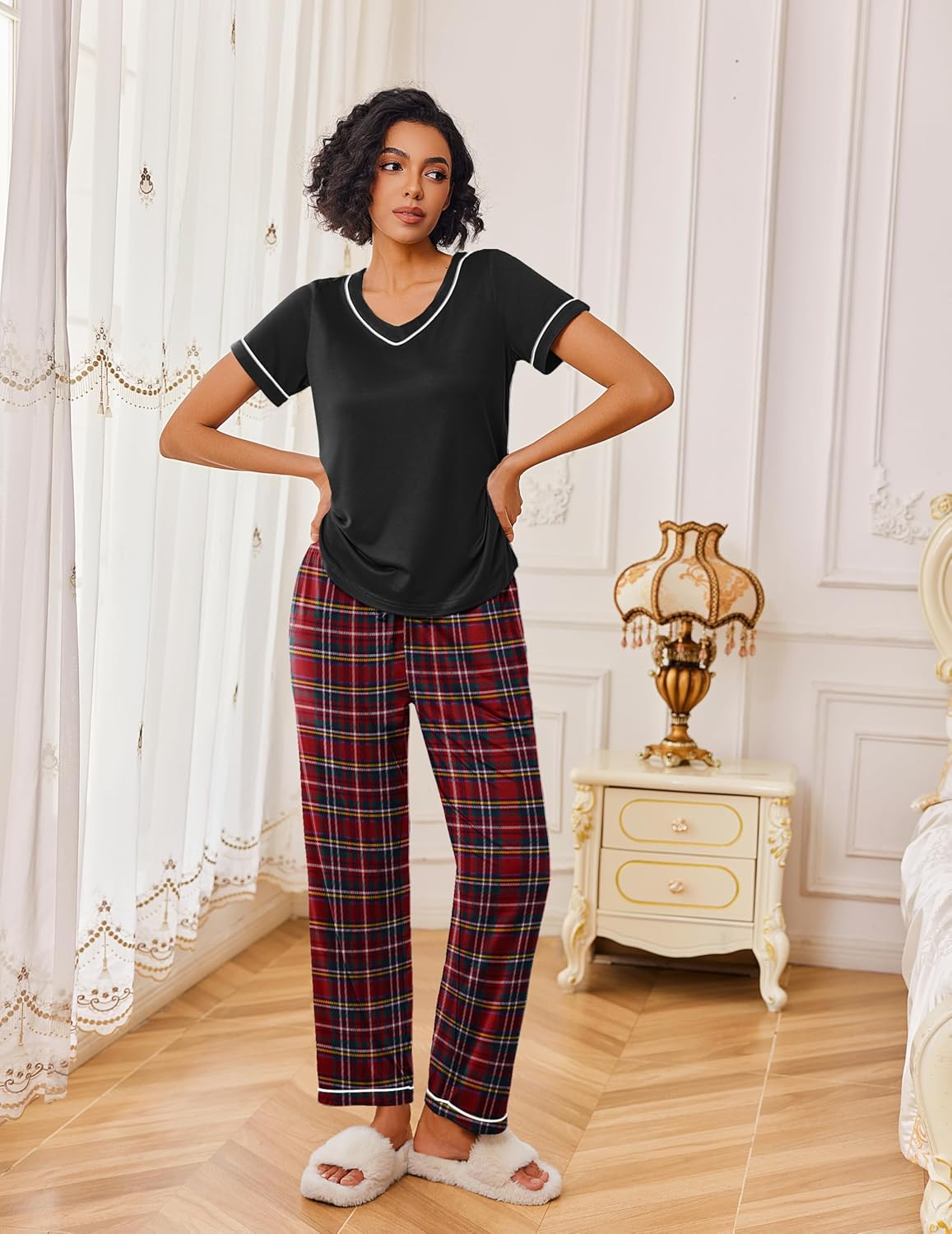 Red plaid lounge set: black short-sleeve top with white trim and matching plaid pants