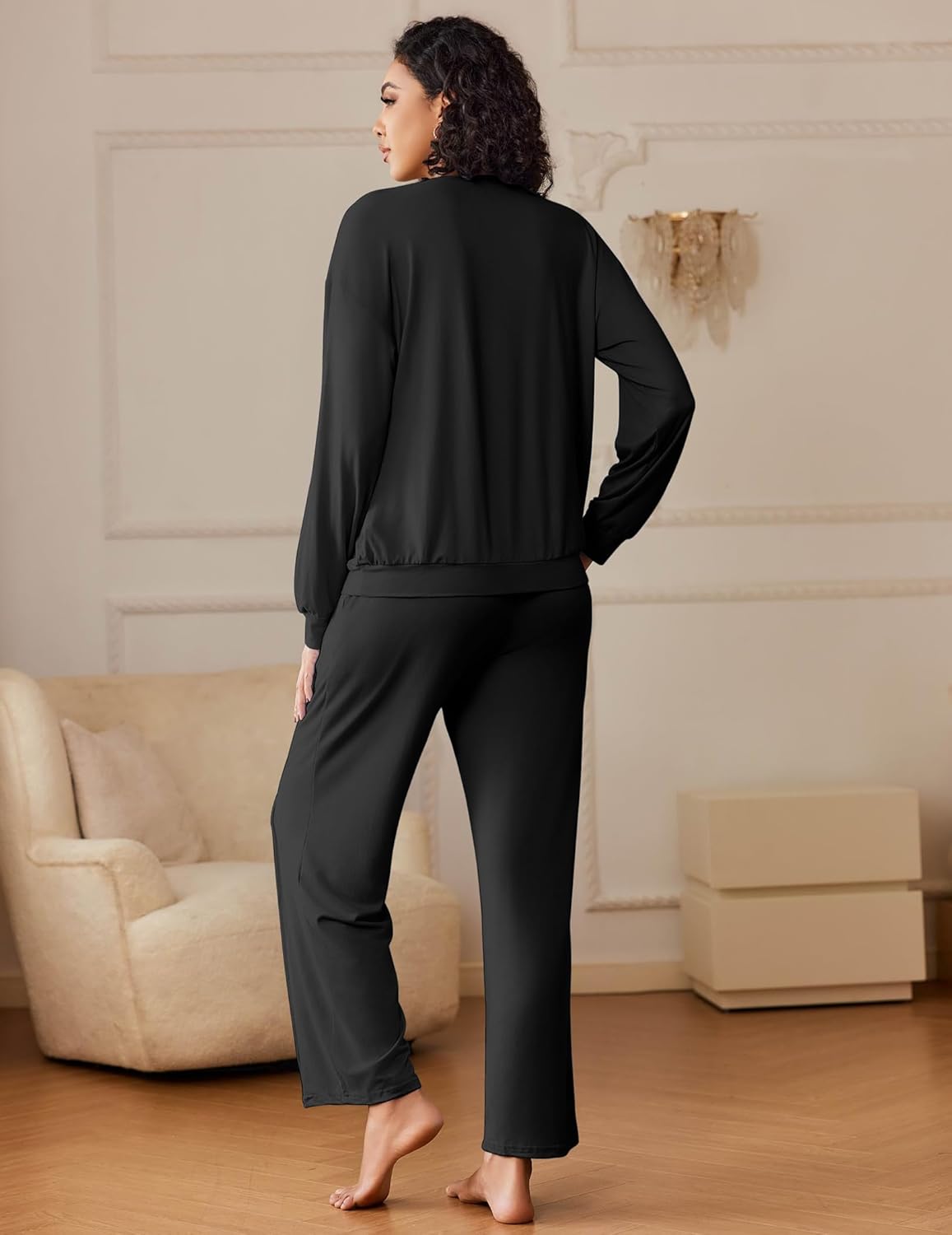 Black lounge set, back view: long-sleeve top and relaxed wide-leg pants