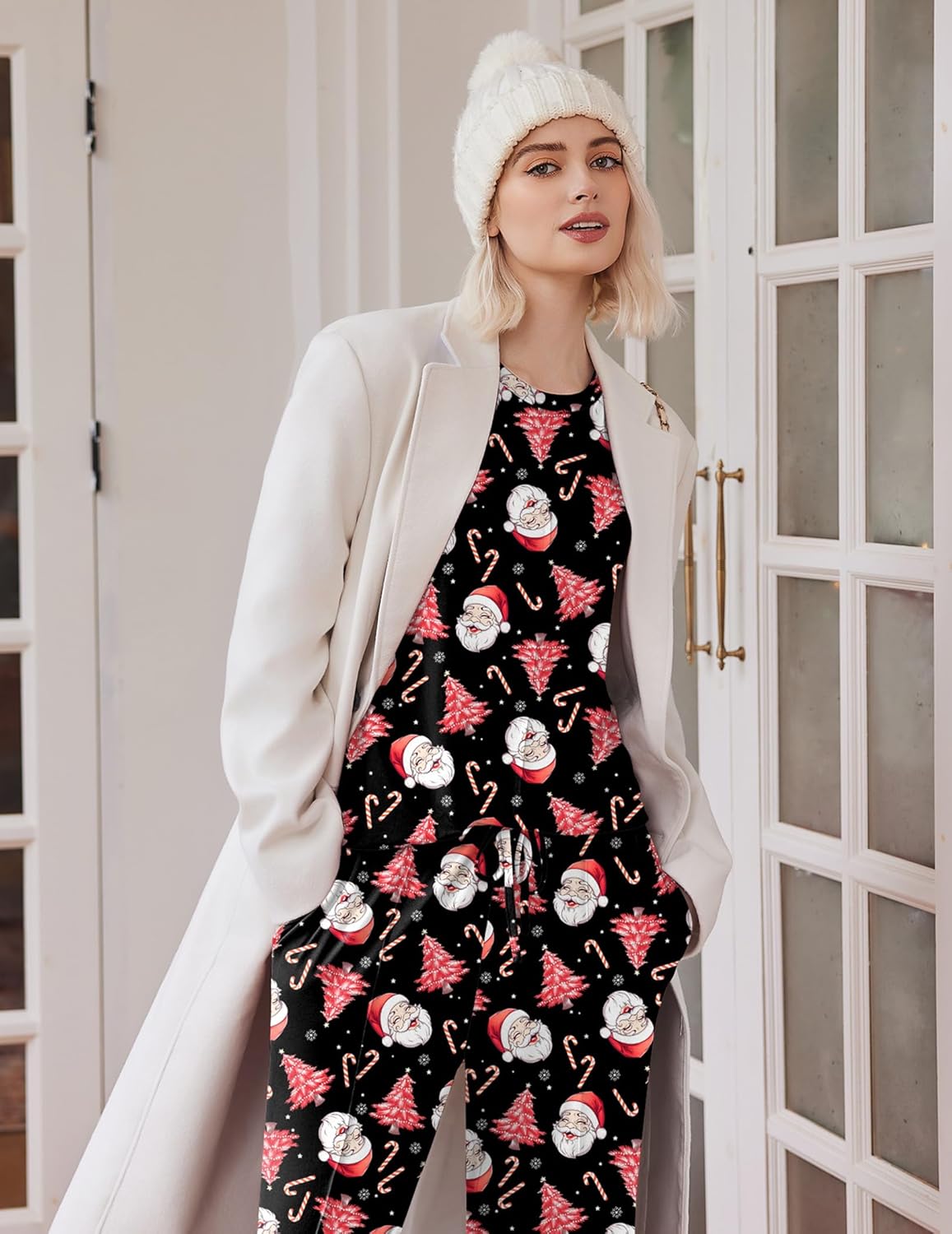 Santa print pajama set under a light coat: long-sleeve top and wide-leg pants