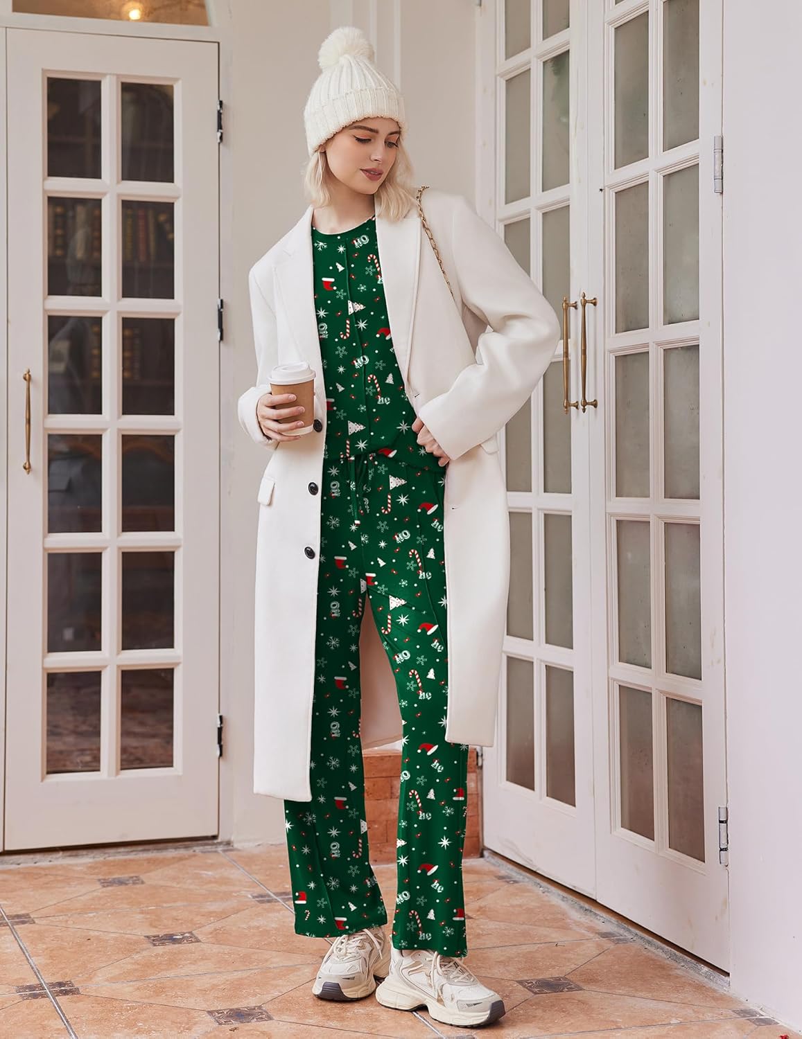 Green Christmas print lounge set under a white coat: long-sleeve top and wide-leg pants