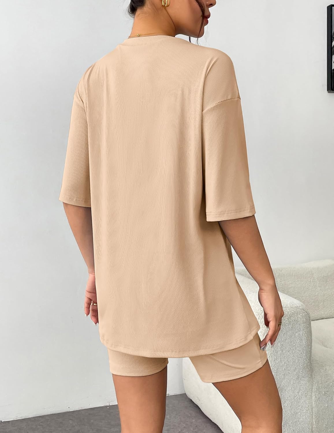 Beige ribbed knit lounge set shown from back: oversized T-shirt and shorts