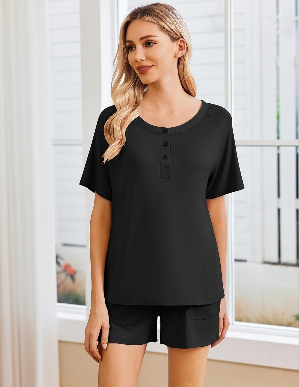 Black lounge set: short-sleeve henley top with button placket and matching pocket shorts