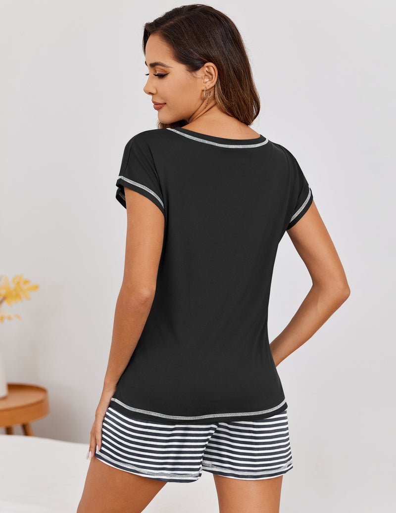 Black short-sleeve loungewear top with black-and-white striped shorts, back view.
