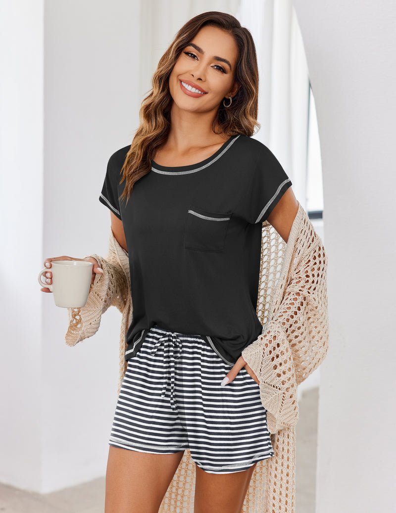 Black loungewear set with short-sleeve top and black-and-white striped shorts.