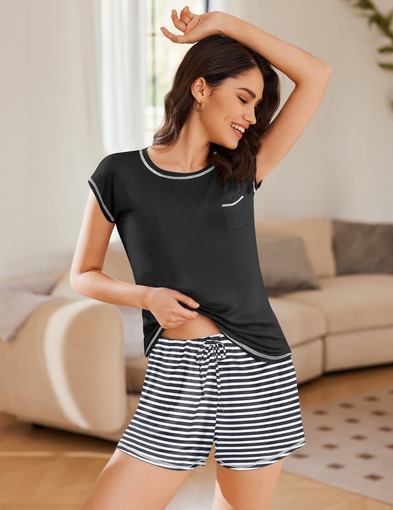 Black short-sleeve loungewear top with black-and-white striped shorts, front view.
