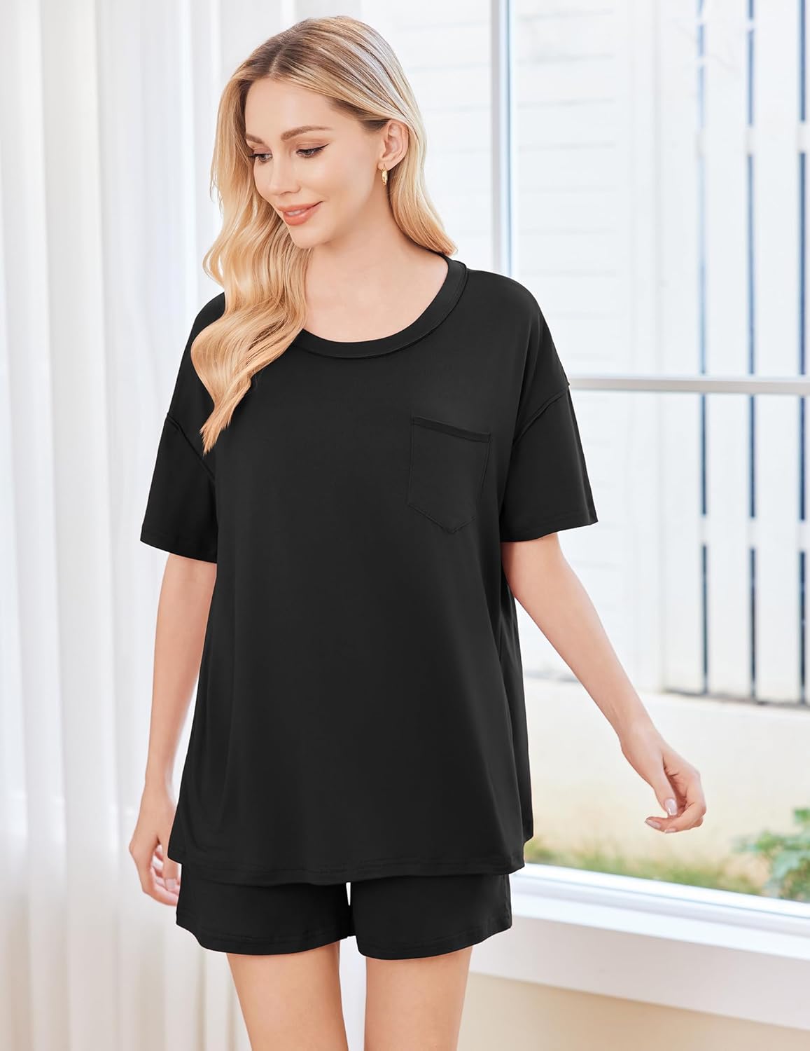 Black short-sleeve pajama set with chest pocket and matching shorts, front view