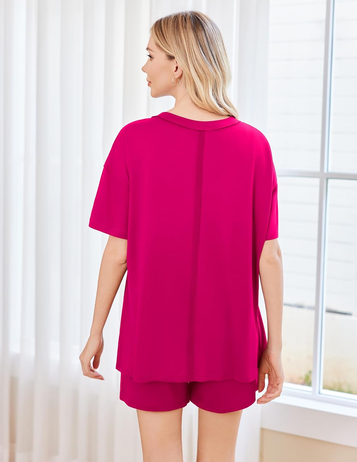 Bright pink pajama set back view: short-sleeve top and matching shorts