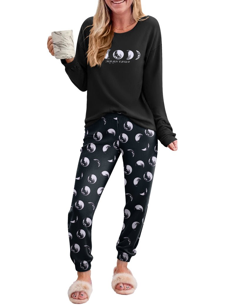 Black long-sleeve pajama top and dark moon-print jogger pants set