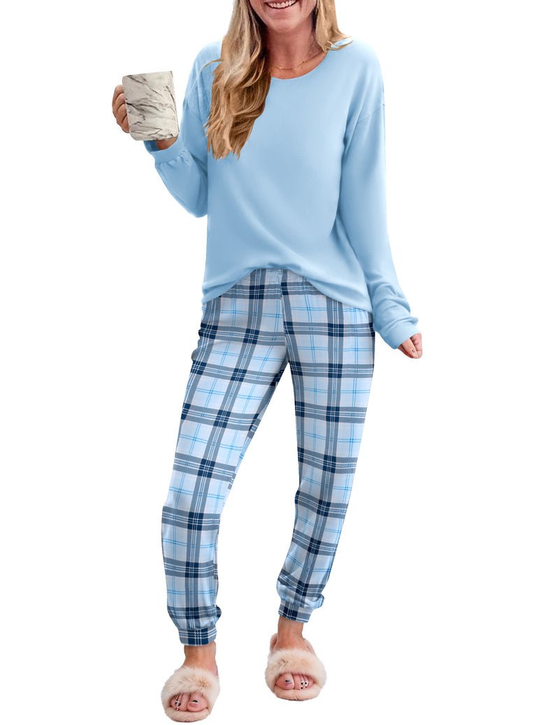 2-piece plaid pajama set with light blue long-sleeve top and blue plaid pants