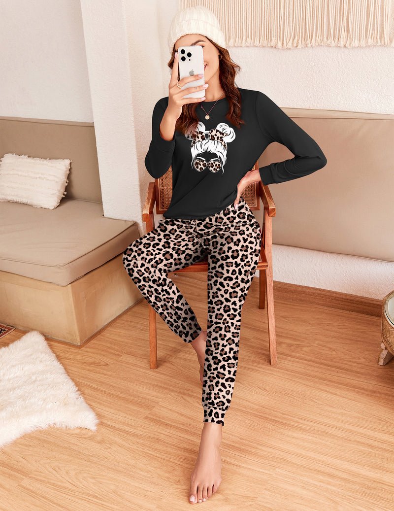 Black pajama long-sleeve set with leopard-print pants shown standing