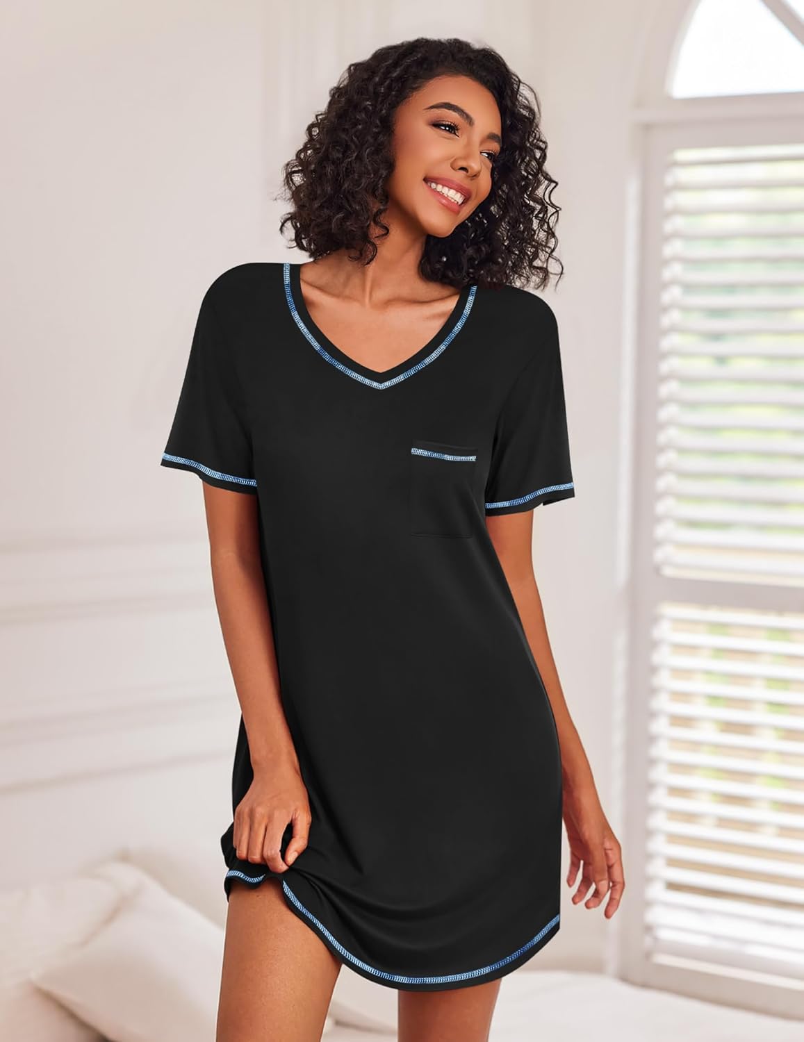 Women’s black short sleeve V-neck nightgown with blue trim and chest pocket