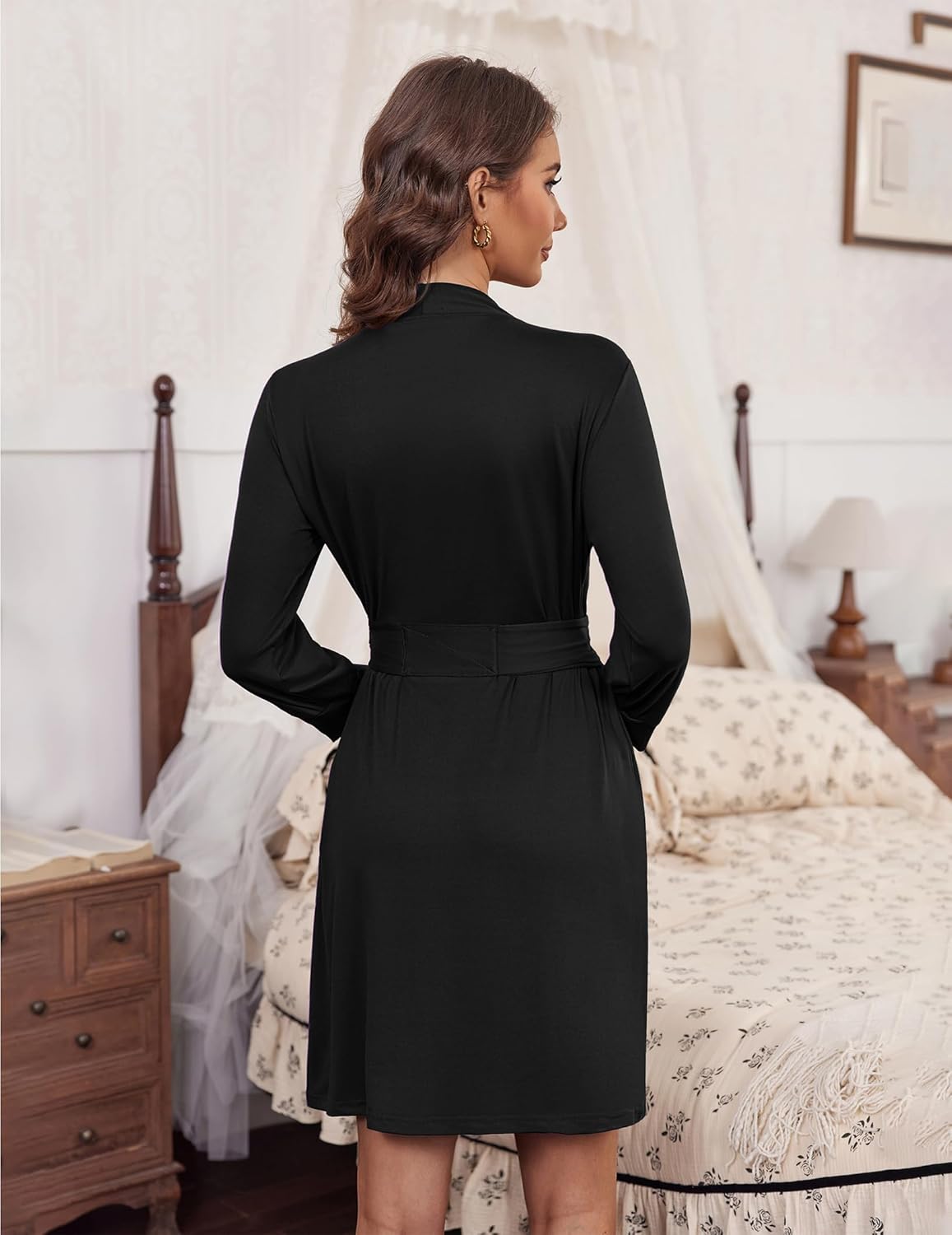 Black 3/4-sleeve knit bathrobe, knee length with belt tie at waist.