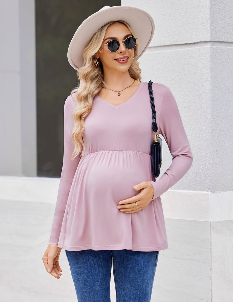 Light pink maternity tunic with V-neck and long sleeves, flared gathered skirt