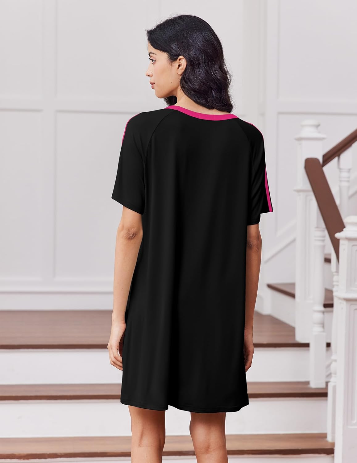 Black sleep dress with short sleeves and crew neck, back view with pink side stripe