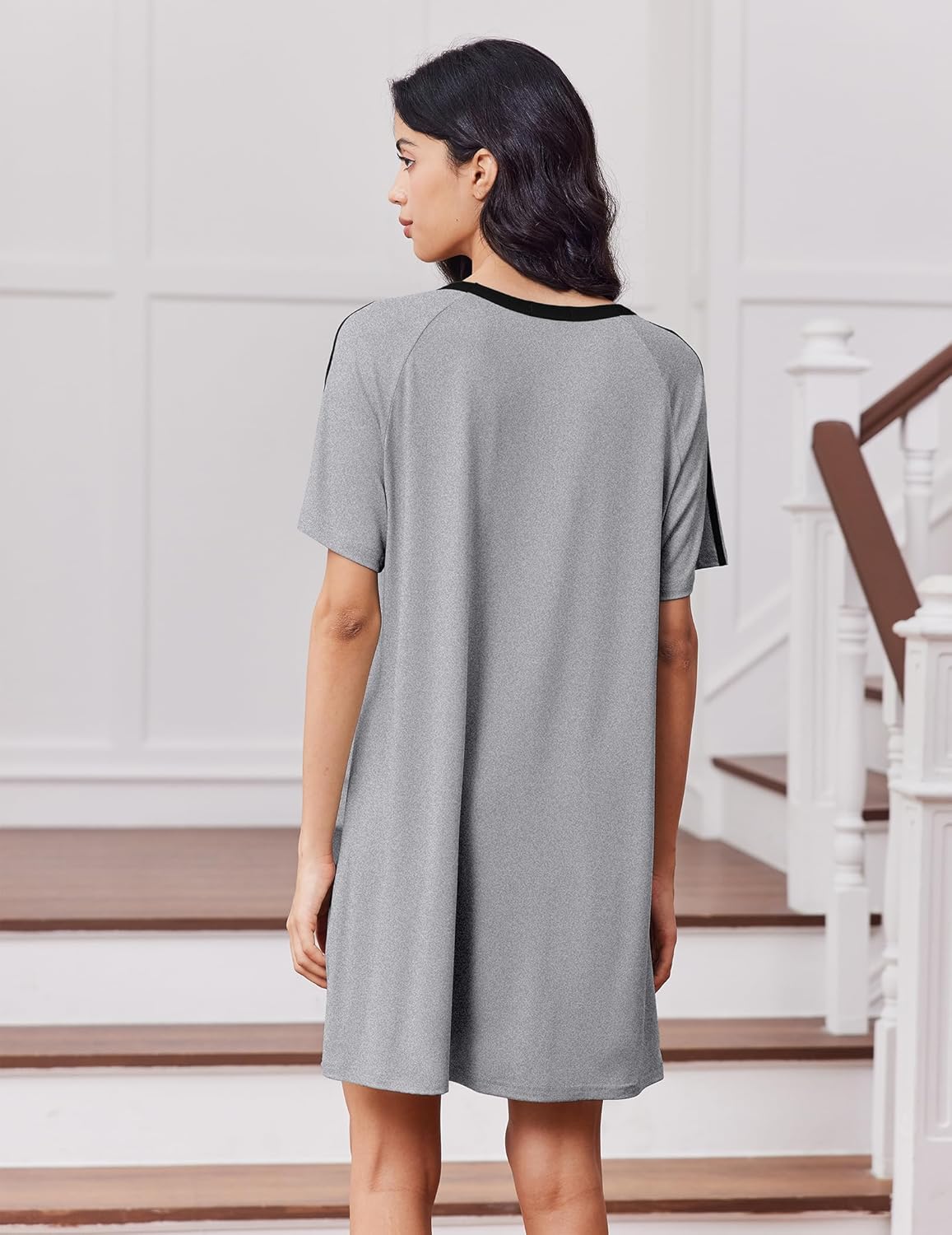 Back view of grey crew-neck sleep dress with black collar trim, short sleeves