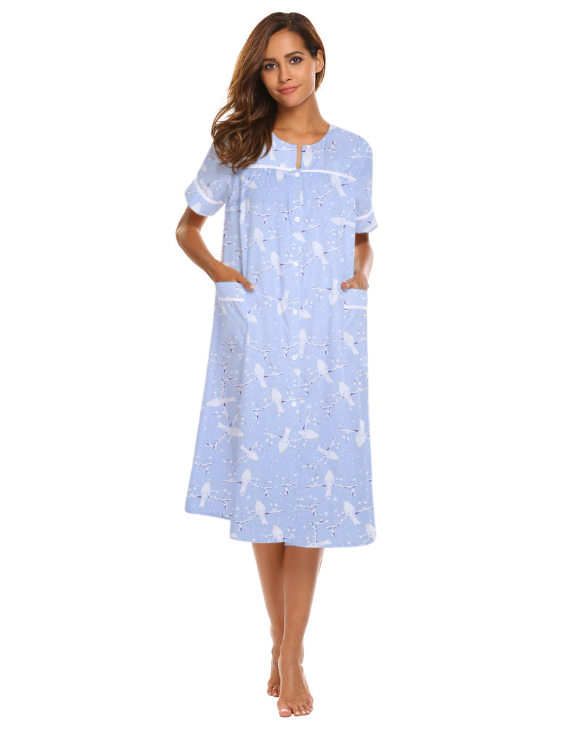 Light blue button-down short-sleeve house dress with pockets, curved neckline, front placket