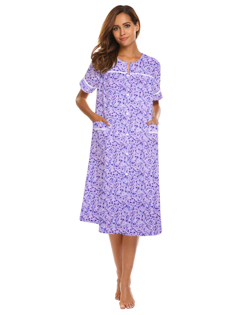 Purple button-down short-sleeve house dress with pockets, curved neckline, front button placket