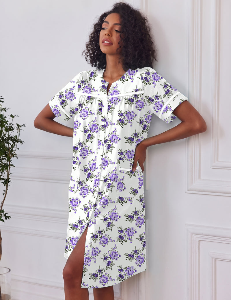 White button-down house dress with short sleeves, pockets, purple floral print, front buttons