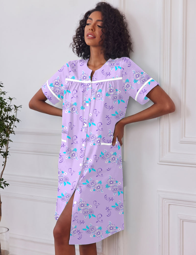 Lilac button-down house dress with short sleeves, pockets, teal floral print, front buttons